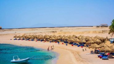 Snorkeling in crystal-clear waters at Sharm El Naga Bay Beach Resort near Hurghada