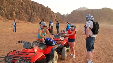 Extreme adventure in Sharm El Sheikh featuring diving, desert biking, and parasailing over the Red Sea