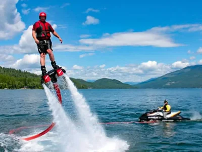 Water Sports Adventure in Sharm El Sheikh with people parasailing, diving, and jet skiing in the Red Sea
