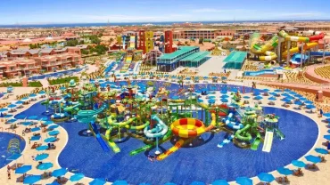 Colorful water slides and pools at Jungle Aqua Park in Hurghada with people enjoying a sunny day
