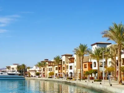 Private vehicle parked near Hurghada Marina during a VIP City Tour with the Red Sea in the background