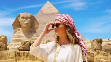 Tourists exploring the Pyramids of Giza on a day tour from Hurghada by mini van