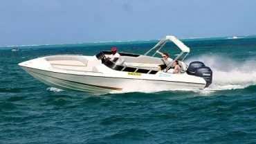 Private speed boat cruising on the Red Sea with blue waters and sunny skies