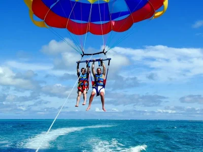 Parasailing over the turquoise Red Sea in Hurghada with a parachute attached to a speedboat