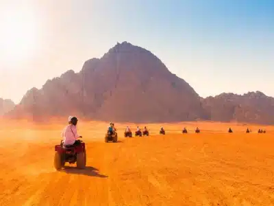 Extreme adventure in Sharm El Sheikh featuring diving, desert biking, and parasailing over the Red Sea