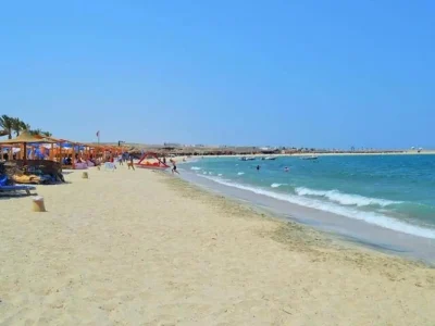 Orange Bay Island boat trip with white sandy beach and turquoise waters in the Red Sea