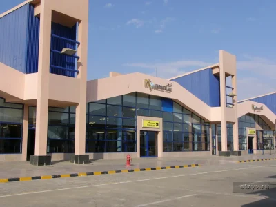 Marsa Alam Shopping Trip with colorful market stalls displaying spices, jewelry, and handmade crafts