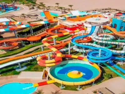 Colorful water slides and pools at Jungle Aqua Park in Hurghada with people enjoying a sunny day