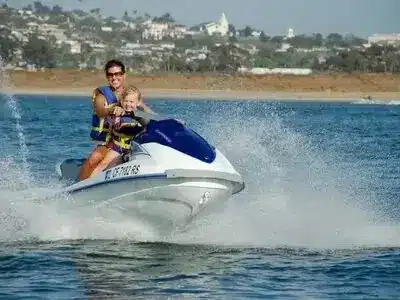 Water Sports Adventure in Sharm El Sheikh with people parasailing, diving, and jet skiing in the Red Sea