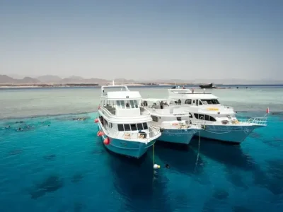 Family on a private boat in the Red Sea fishing and snorkeling together