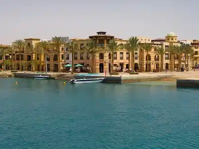 Private vehicle parked near Hurghada Marina during a VIP City Tour with the Red Sea in the background