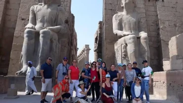 Tourists exploring Karnak Temple during a Luxor day tour from Hurghada by mini van