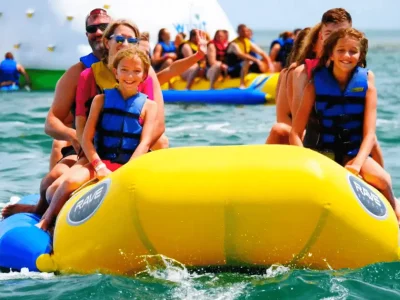 Water Sports Adventure in Sharm El Sheikh with people parasailing, diving, and jet skiing in the Red Sea