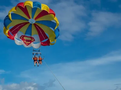 Parasailing over the turquoise Red Sea in Hurghada with a parachute attached to a speedboat