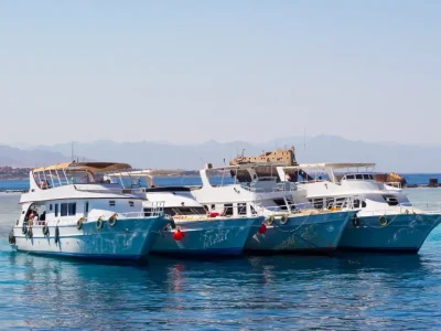 Family on a private boat in the Red Sea fishing and snorkeling together